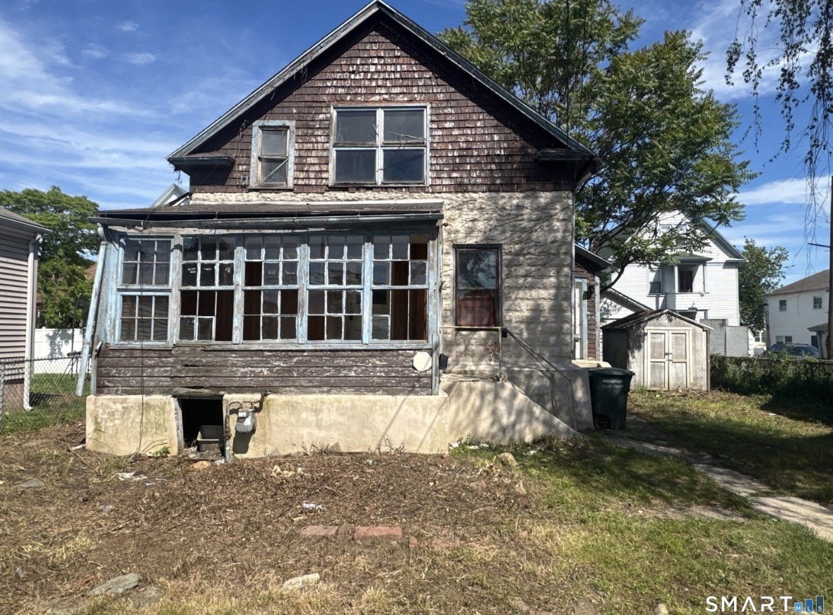 Distressed house exterior before renovation